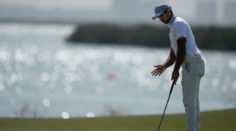 Aaron Rai of England reacts after missing a putt on the 8th hole during the final round of the Abu Dhabi Golf Championship in Abu Dhabi, United Arab Emirates, Sunday, Nov. 9, 2025. (AP Photo/Altaf Qadri)