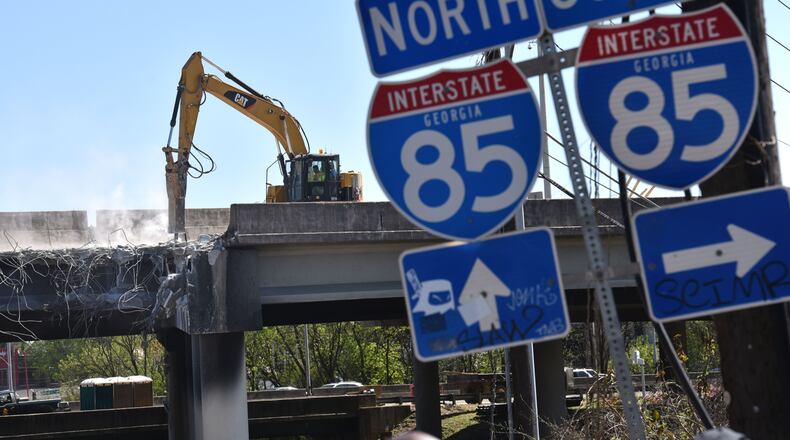 April 1, 2017 Atlanta - Crews demolish  damaged sections of I-85 bridge structures on Saturday, April 1, 2017. Necessary work is continuing on the damaged sections of I-85 bridge structures. This includes demolition of the existing failed and damaged structures - which includes two 350-foot sections of interstate, one section each in both the northbound and southbound lanes, totaling approximately 700 feet - as well as all reconstruction activities. HYOSUB SHIN / HSHIN@AJC.COM