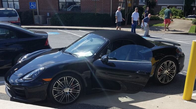 The owner of a Porsche has been charged with reckless conduct after a note stating his car was wired to explode was left in plain view. Credit: Marietta Police Department