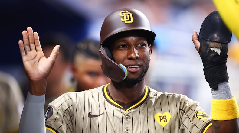 Jurickson Profar of the San Diego Padres celebrates with teammates after scoring a run against the Miami Marlins during the third inning at loanDepot park on Saturday, Aug. 10, 2024, in Miami. (Megan Briggs/Getty Images/TNS)