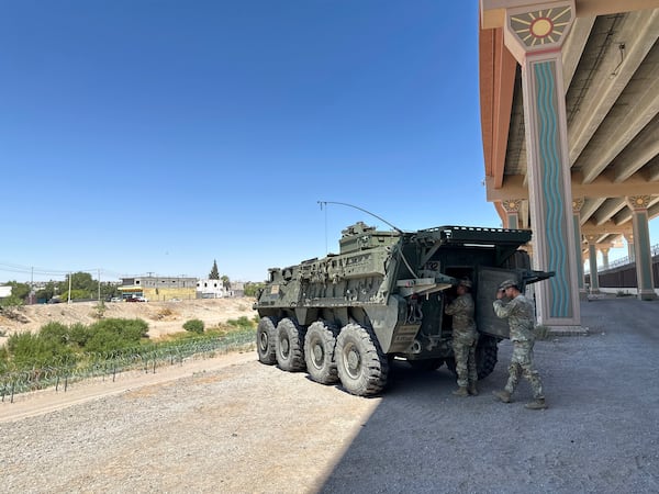 A military transport and surveillance vehicle is parked in a newly designated national defense area on June 11, 2025, along the southern U.S. border in El Paso, Texas. (AP Photo/Morgan Lee)