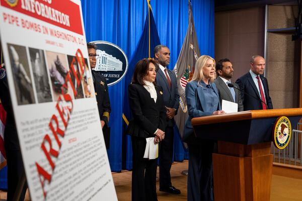 Attorney General Pam Bondi (third from right) spoke at a news conference in Washington on Thursday about an arrest in a pipe bomb case. (Alex Brandon/AP)