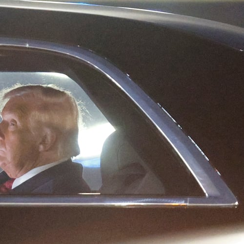 President Donald Trump is seen in his limousine, known as "The Beast," upon his arrival at Joint Base Andrews, Md., Wednesday, Nov. 5, 2025, after giving a speech at the American Business Forum in Miami. (AP Photo/Luis M. Alvarez)