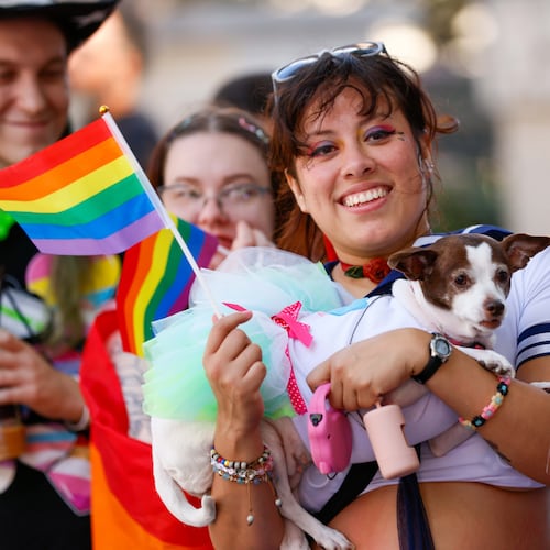 Nuddle Piñon from Atlanta holds her dog “Bonita.” during the annual Pride Parade, which begins on Peachtree Street and ends in Piedmont Park on Sunday, October 13, 2024.
(Miguel Martinez / AJC