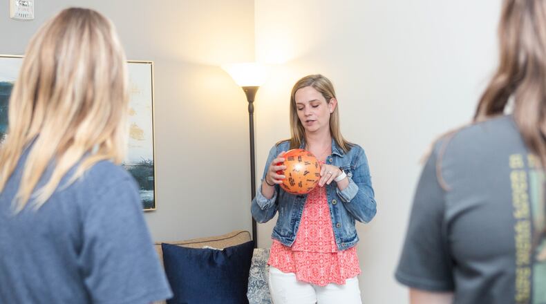 During the first week, Jessica Alexander starts with an ice-breaker activity using a ball that has questions written on it. The ball is tossed around generating answers such as introducing themselves, why they are there, what they hope to learn, etc.