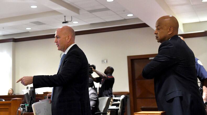 Attorney Noah Pines (left) and Dekalb County Sheriff Jeff Mann (right) walk into the courtroom at the Atlanta Municipal Court in Atlanta on Thursday. Mann pleaded guilty to charges of obstruction and prohibited conduct stemming from his arrest in Piedmont Park. (REBECCA BREYER)