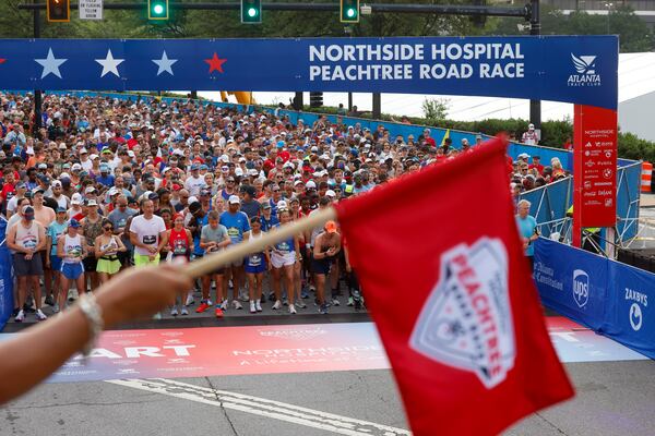 A remarkable start-line scene is shown as thousands of runners prepare to take on the 2026 Northside Hospital Peachtree Road Race. (Arvin Temkar/AJC)