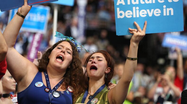 PHILADELPHIA, PA - JULY 25: Supporters of Sen. Bernie Sanders (I-VT) stand and cheer as he delivers remarks on the first day of the Democratic National Convention at the Wells Fargo Center, July 25, 2016 in Philadelphia, Pennsylvania. An estimated 50,000 people are expected in Philadelphia, including hundreds of protesters and members of the media. The four-day Democratic National Convention kicked off July 25. (Photo by Joe Raedle/Getty Images)