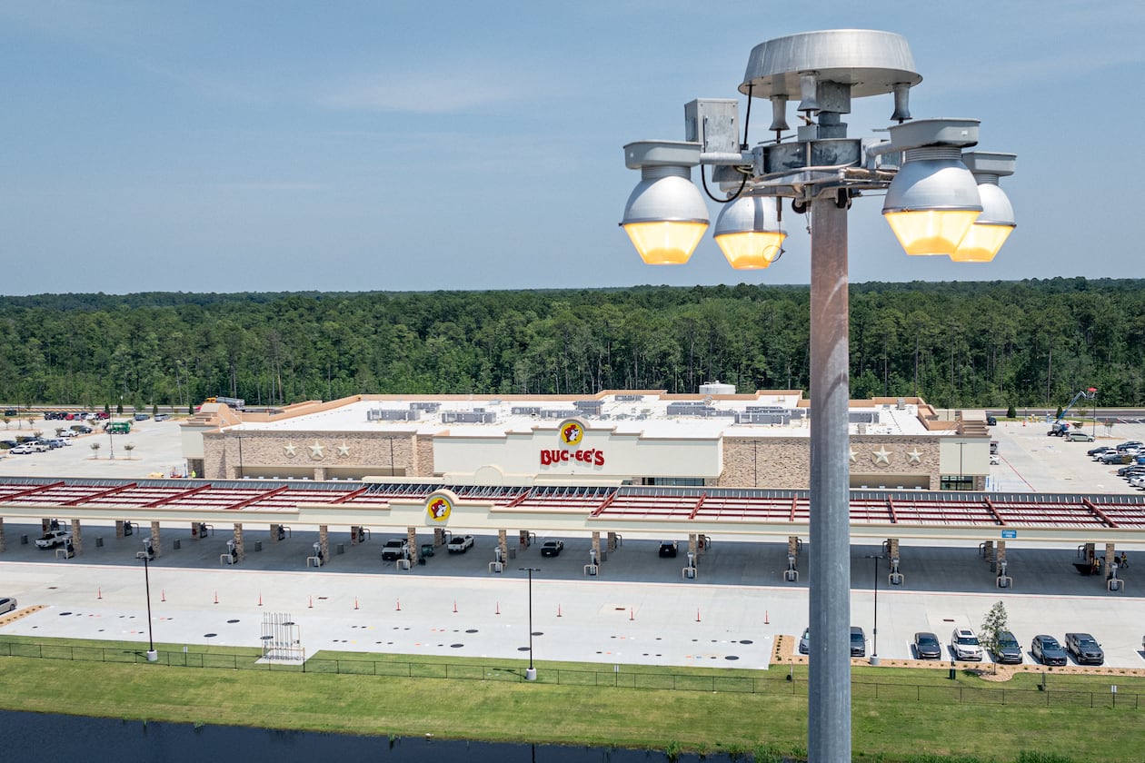 High-mast lights stand at I-95's Exit 42, the location of the new Buc-ee’s in Brunswick, on June 25, 2025. Buc-ee's has refused to comment on the lights, leading some critics to suspect the company is the reason for Glynn County's lack of action on the matter. (Justin Taylor/The Current GA/CatchLight Local)
