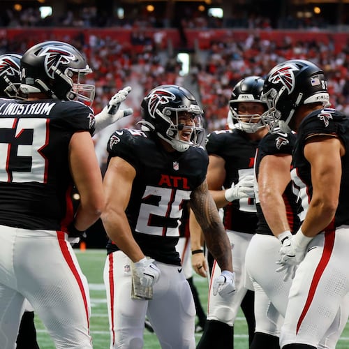 Atlanta Falcons running back Tyler Allgeier (25) reacts with teammates after scoring his team's third touchdown during the first half of an NFL football game against the Carolina Panthers at Mercedes-Benz Stadium in Atlanta on Sunday, Nov. 16, 2025.
(Miguel Martinez/ AJC)