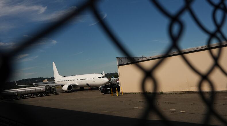 FILE - A U.S. Immigration and Customs Enforcement flight operates out of King County International Airport-Boeing Field, Aug. 23, 2025, in Seattle. (AP Photo/Lindsey Wasson, File)