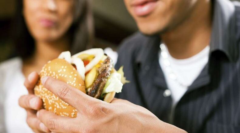 People on vacation often indulge in burgers and other fattening comfort foods they wouldn't dream of touching at home.