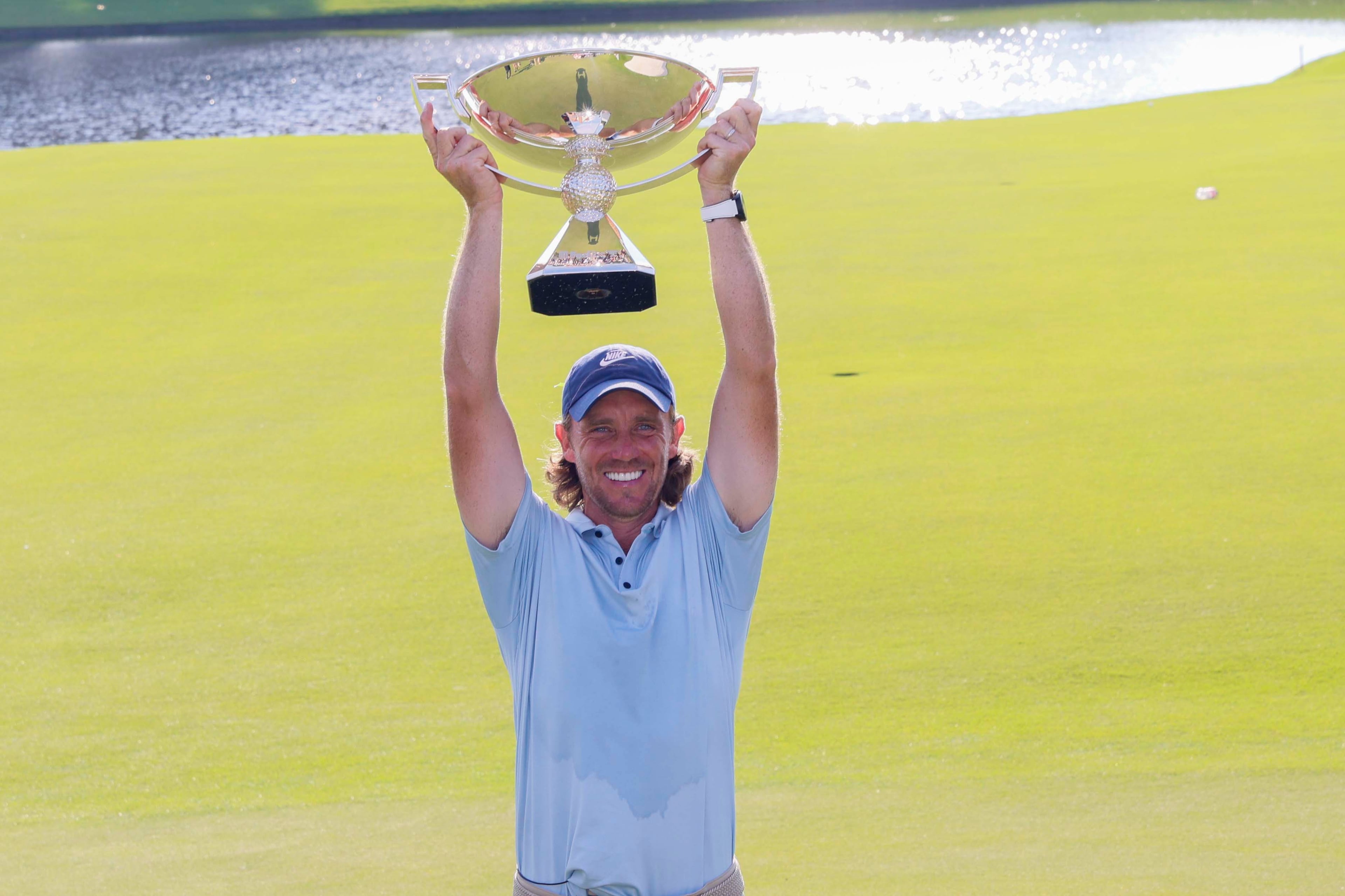 Tommy Fleetwood, from England, poses for the media as he holds the PGA Tour Championship trophy at East Lake Golf Club on Sunday, Aug. 24, 2025, in Atlanta.(Miguel Martinez/ AJC)