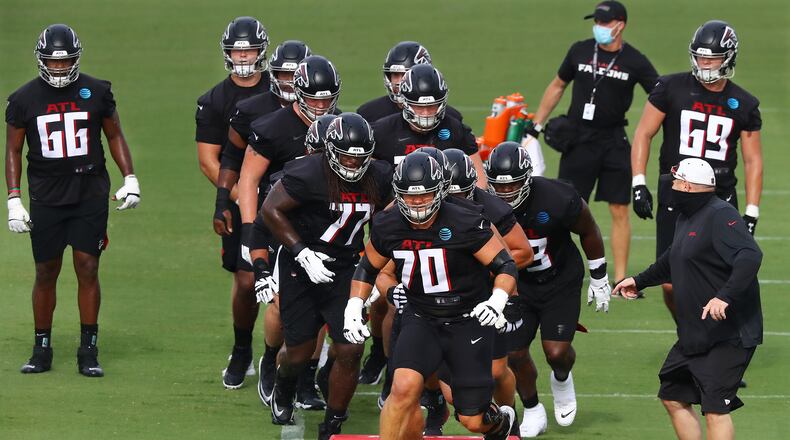 081520 Flowery Branch: Atlanta Falcons tackle Jake Matthews leads offensive lineman through an agility drill during training camp on Saturday, August 15, 2020 in Flowery Branch. Curtis Compton ccompton@ajc.com
