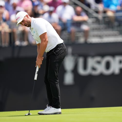 Wyndham Clark reacts after missing a putt on the 13th hole during the second round of the U.S. Open golf tournament at Shinnecock Hills Golf Club in Southampton, N.Y., Friday, June 19, 2026.(AP Photo/David J. Phillip)