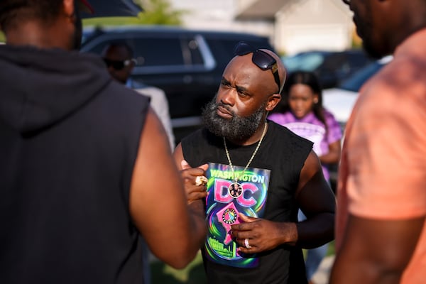 Tray Chaney greets his neighbors as he brought back his 19-year-old son, Malachi, to their Henry County home, which was destroyed by an EF-2 tornado, Wednesday, June 25, 2025, in Locust Grove, Ga. (Jason Getz/AJC)