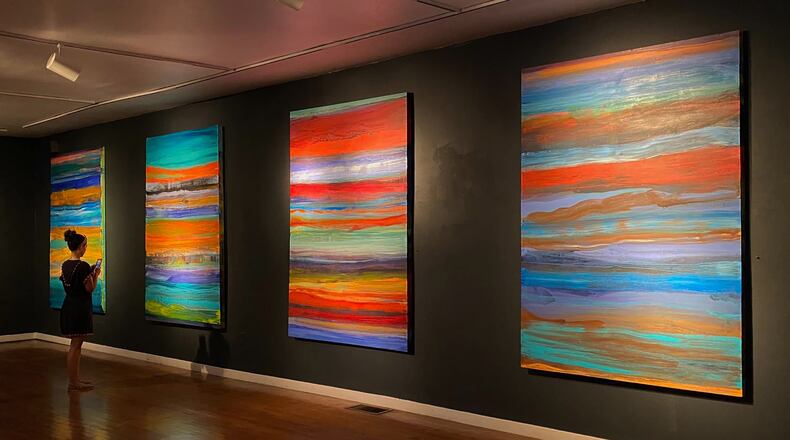 Deanna Sirlin's paintings glow with color in her "Wavelength" exhibit at Chastain Gallery.