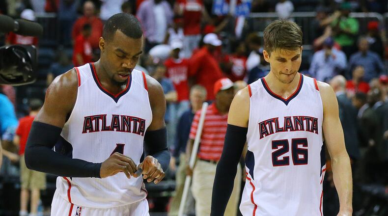 050315 ATLANTA: Hawks Paul Millsap and Kyle Korver walk off the court falling to the Wizards 104-98 in game 1 of the Eastern Conference Semifinals on Sunday, May 3, 2015, in Atlanta. Paul Millsap and Kyle Korver walk leave court after Hawks blew a 12-point lead in loss to Washington. (Curtis Compton, AJC)