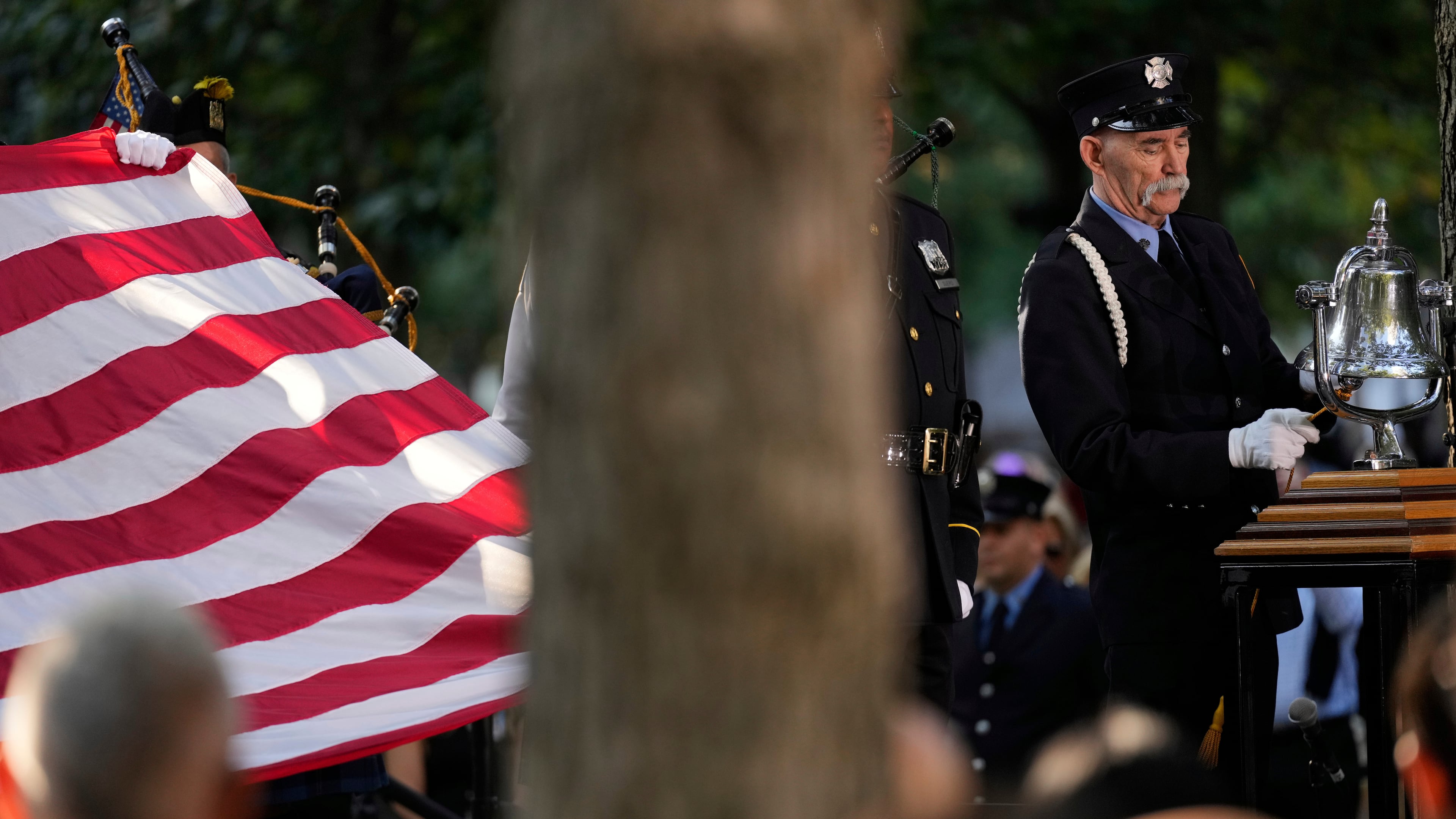 A firefighter rings a bell during a ceremony to mark the 24th anniversary of the 9/11 attacks, Thursday, Sept. 11, 2025, in New York. (AP Photo/Seth Wenig)
