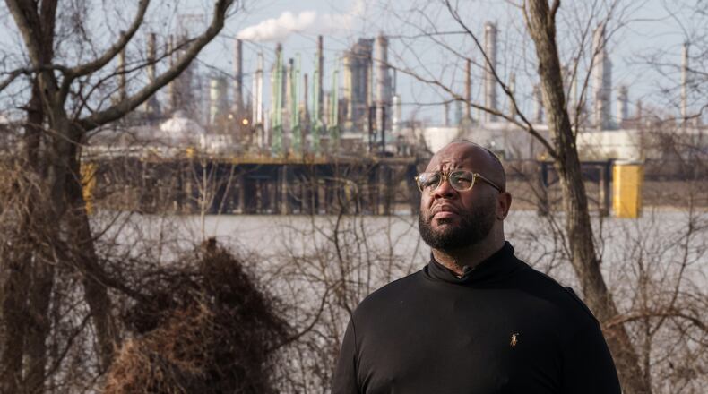 Gary C. Watson, Jr., who was born and raised in St. John the Baptist Parish, poses for a photo in Edgard, La., Wednesday, Feb. 18, 2026, across the river from a Marathon Petroleum Refinery. (AP Photo/Matthew Hinton)