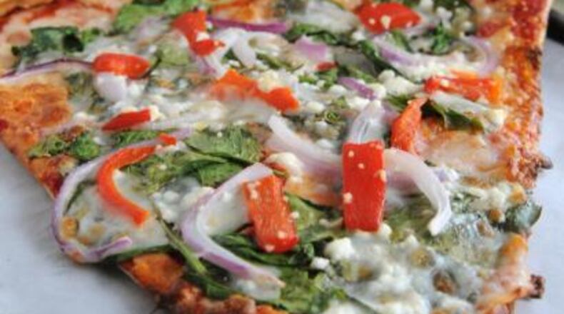 The Monster Slice has a crust that's airy and has a tendency to crunch and crumble.