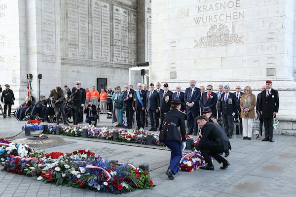 French President Emmanuel Macron, right, lays a wreath at the Tomb of the Unknown soldier during ceremonies marking the 80th anniversary of the end of World War II in Europe, Thursday May 8, 2025 in Paris. (Thomas Samson, Pool via AP)
