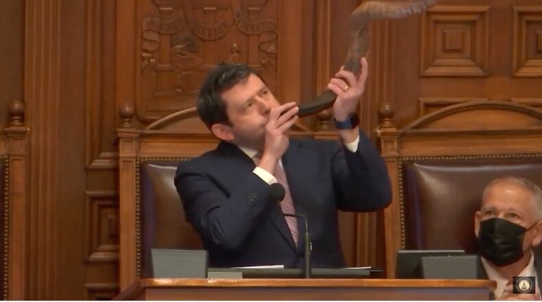 Rabbi Larry Sernovitz of Temple Kol Emeth in Marietta blows the shofar before giving the opening prayer on Feb. 8, 2022 in the Georgia House.