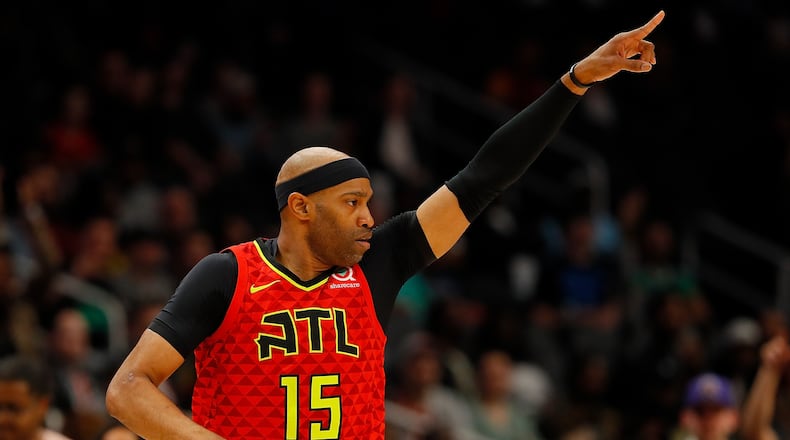 Vince Carter  of the Atlanta Hawks reacts after hitting a three-point basket against the Memphis Grizzlies in the first half at State Farm Arena on March 13, 2019 in Atlanta, Georgia.