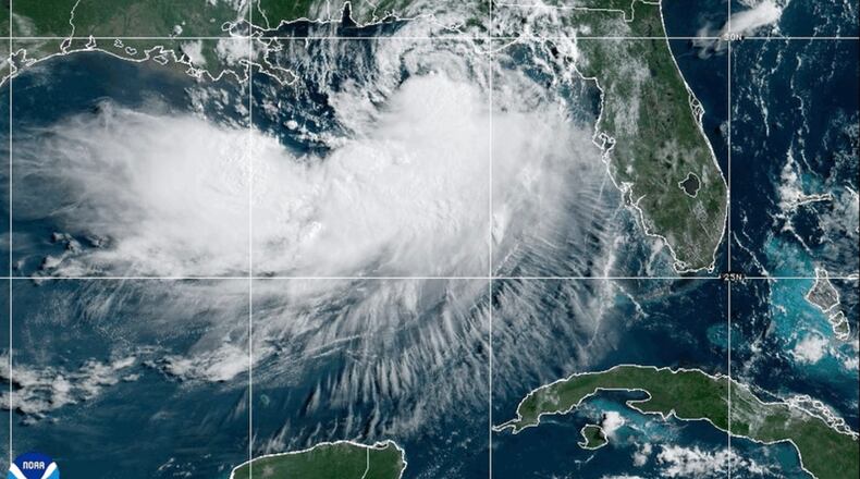 This NOAA satellite image taken at 10:30 a.m. EST on Tuesday, July 21, 2026, shows Tropical Storm Bertha moving along the Gulf of Mexico's northern coast. (NOAA via AP)