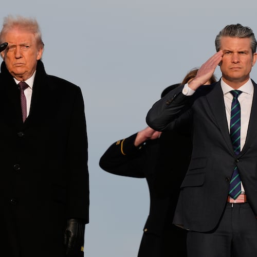 President Donald Trump and Defense Secretary Pete Hegseth salute as carry teams move the transfer cases with the remains of Iowa National Guard soldiers Sgt. William Nathaniel Howard, 29, of Marshalltown, Iowa, and Sgt. Edgar Brian Torres-Tovar, 25, of Des Moines, Iowa, and civilian interpreter Ayad Mansoor Sakat, who were killed in an attack in Syria, during a casualty return, Wednesday, Dec. 17, 2025 at Dover Air Force Base, Del. (AP Photo/Julia Demaree Nikhinson)
