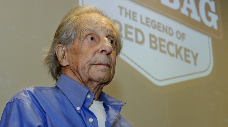 In this photo taken July 26, 2016 in Seattle, Fred Beckey, the legendary mountain climber who has bagged more first ascents than any other mountaineer and wrote the definitive guidebooks to a major North American mountain range, sits in front of a screen bearing the logo for “Dirtbag: The Legend of Fred Beckey,” an upcoming documentary feature film about his life. Beckey, 93, was waiting to begin narrating a personal slide show to a sold-out crowd at an event to kick-off a funding drive for the movie. (AP Photo/Ted S. Warren)