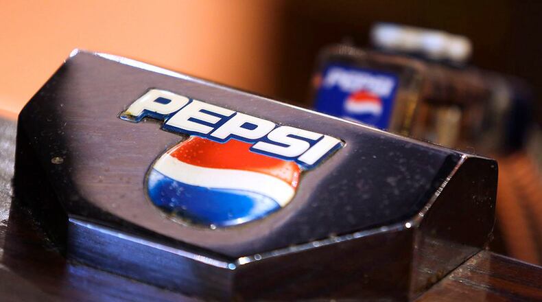 A Pepsi logo sits on a PepsiCo Inc. soft drinks pump on the bar inside The Yew Tree pub, operated by Chef and Brewer, a unit of Spirit Pub Co., in Great Horkesley, U.K., on Wednesday, Oct. 15, 2014. Spirit, the owner of more than 1,200 U.K. outlets including Chef & Brewer and Wacky Warehouse, said it rejected a 661 million-pound ($1.1 billion) all-share takeover approach from competitor Greene King Plc. (Chris Ratcliffe/Bloomberg via Getty Images)