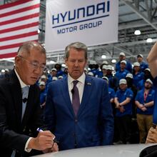 Hyundai executive Euisun Chung stands with Georgia Gov. Brian Kemp at the automaker's Metaplant in southeast Georgia in March 2025. (Mike Stewart/AP)