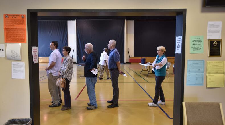 Tucker residents lined up to elect their first city government leaders at The Ministry Center of First Baptist Church of Tucker on March 1. Tucker and existing cities may soon seek to expand. HYOSUB SHIN / HSHIN@AJC.COM