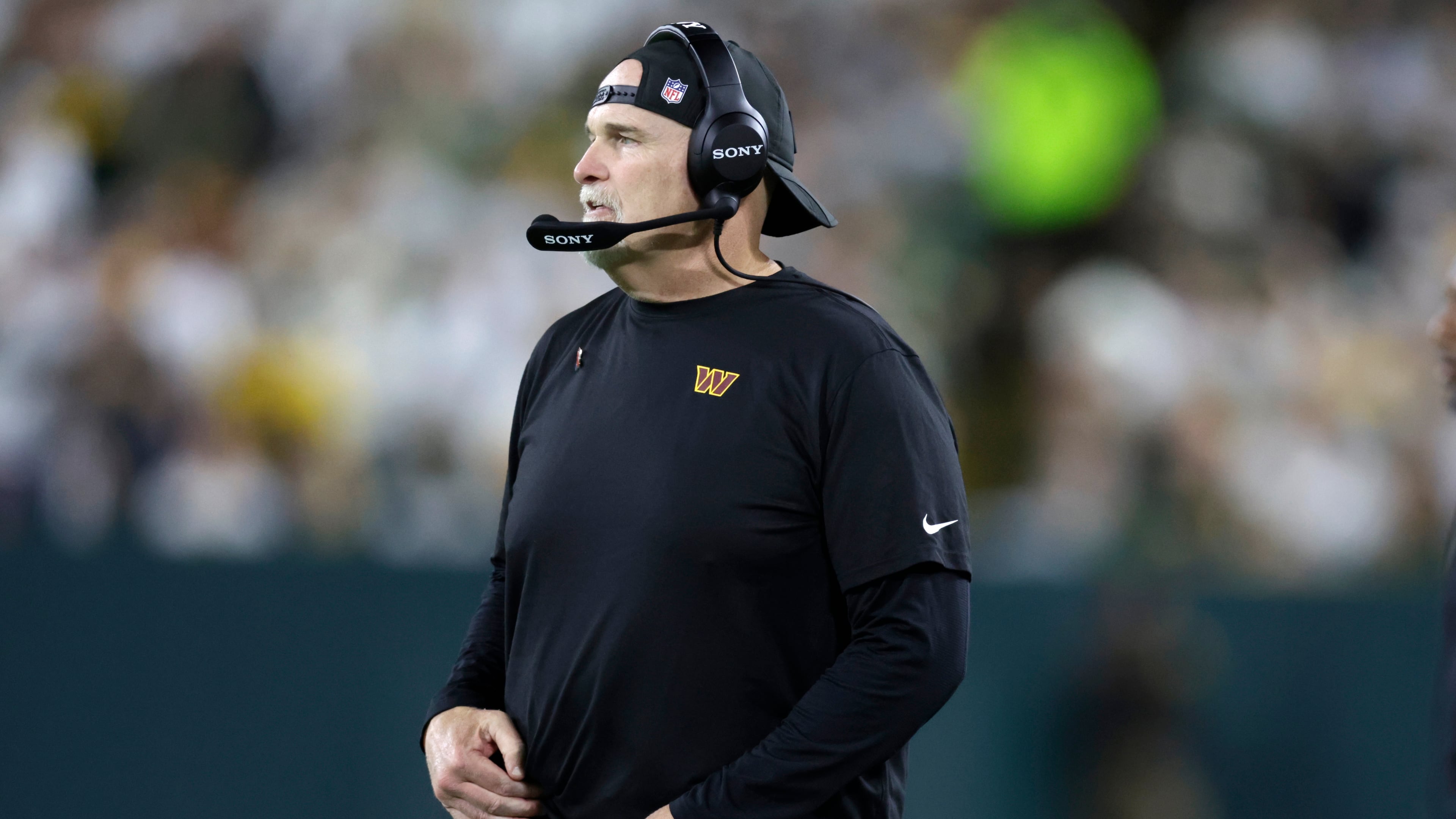 Washington Commanders head coach Dan Quinn watches from the sidelines during the second half of an NFL football game against the Green Bay Packers Thursday, Sept. 11, 2025, in Green Bay, Wis. (AP Photo/Matt Ludtke)