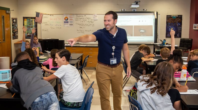 Spence Ford, a science teacher at Samuel M. Inman Middle School in Atlanta, says he is intentional about bringing lessons about climate change to the sixth graders in his earth science classes, but he doesn’t always know how or when he is going to include those lessons. STEVE SCHAEFER / SPECIAL TO THE AJC