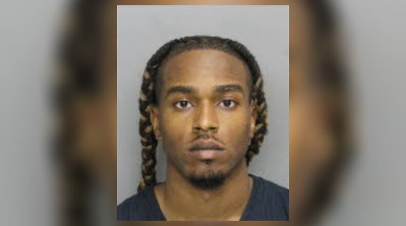 Bryan Anthony Rhoden faces murder and other charges in last year's triple slaying at a Cobb County golf course.