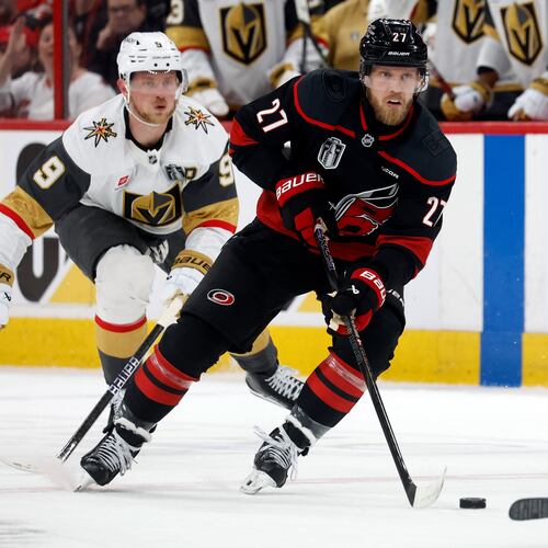 Carolina Hurricanes' Nikolaj Ehlers (27) controls the puck while followed by Vegas Golden Knights' Jack Eichel (9) during the second period in Game 2 of the NHL hockey Stanley Cup Final series in Raleigh, N.C., Thursday, June 4, 2026. (AP Photo/Karl DeBlaker)