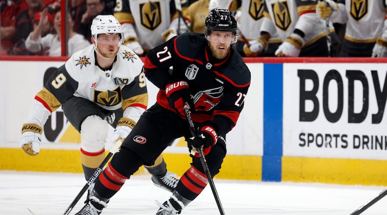 Carolina Hurricanes' Nikolaj Ehlers (27) controls the puck while followed by Vegas Golden Knights' Jack Eichel (9) during the second period in Game 2 of the NHL hockey Stanley Cup Final series in Raleigh, N.C., Thursday, June 4, 2026. (AP Photo/Karl DeBlaker)