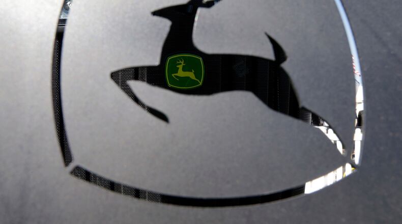 FILE - A John Deer emblem is seen at the Husker Harvest Days farm show in Wood River, Neb., Sept. 12, 2018. (AP Photo/Nati Harnik, File)