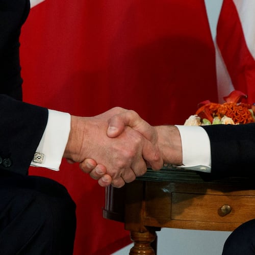 FILE - President Donald Trump shakes hands with French President Emmanuel Macron during a meeting at the U.S. Embassy, May 25, 2017, in Brussels. (AP Photo/Evan Vucci, file)