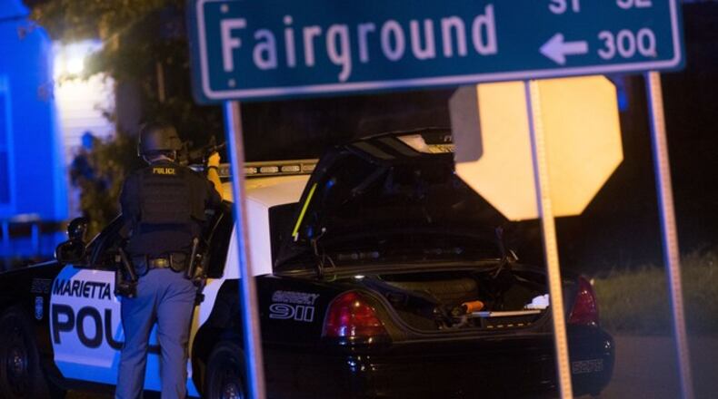 Police surround a gun shop Tues., July 19, 2015 in Marietta. (Credit: Channel 2 Action News)