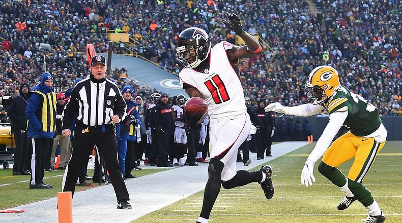 Julio Jones of the Atlanta Falcons scores a touchdown in front of Josh Jackson of the Green Bay Packers during the first half of a game at Lambeau Field on December 09, 2018 in Green Bay, Wisconsin. (Photo by Stacy Revere/Getty Images)