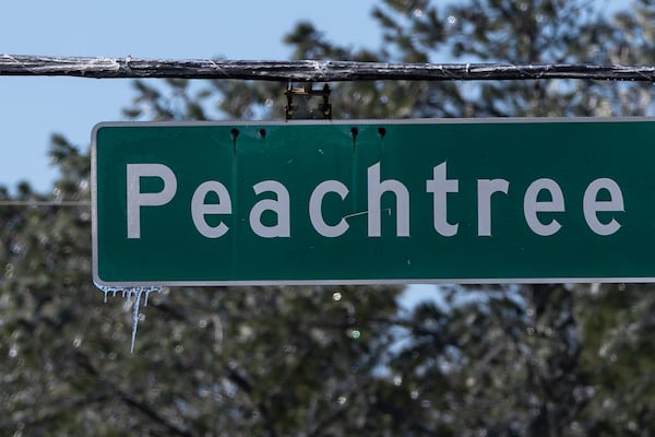 Icicles cling to a road sign on Peachtree Parkway on Monday, Jan. 26, 2026, in Cumming. (Ben Hendren for the AJC)