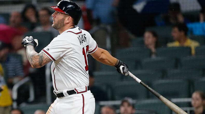 Matt Adams follows through on his two-run homer, his first as a Brave, in the fifth inning of Monday's game against the Pirates at SunTrust Park.