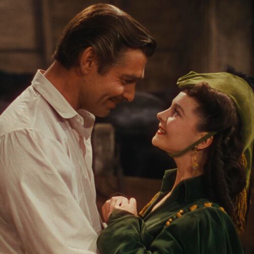 Clark Gable, left, as Rhett Butler, and Vivien Leigh as Scarlett O'Hara in a scene from the film "Gone With the Wind." (Warner Bros. Home Entertainment/AP file_