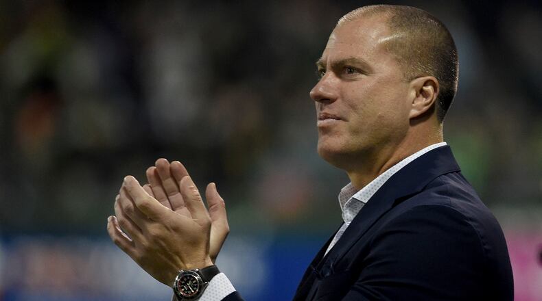 Giovanni Savarese, head coach of the Portland Timbers, cheers on his team during the first half of the match against the Sporting Kansas City at Providence Park on November 25, 2018 in Portland, Oregon. (Photo by Steve Dykes/Getty Images)