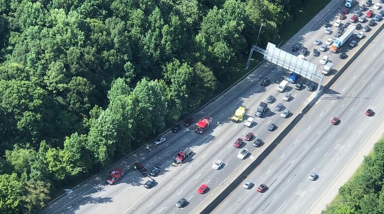 The WSB Skycopter spotted this overturned pickup truck that spread debris on I-285/westbound at I-675, causing big delays Tuesday afternoon. DOUG TURNBULL / TRIPLE TEAM TRAFFIC
