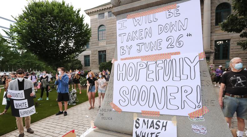 061720 Decatur: Local residents and protesters hold a rally calling on DeKalb County to follow a judgeâs order to âswiftlyâ remove the Confederate monument from Decatur Square on Wednesday, June 17, 2020, in Decatur. In an order issued Friday afternoon, DeKalb County Superior Court Judge Clarence Seeliger said the monument to the Confederacy in the square should be relocated by midnight on June 26. The city argued that the 30-foot obelisk had become a threat to public safety during recent protests about racism and police violence toward black people. Seeligerâs order says the monument should be placed into storage until further notice. Curtis Compton ccompton@ajc.com