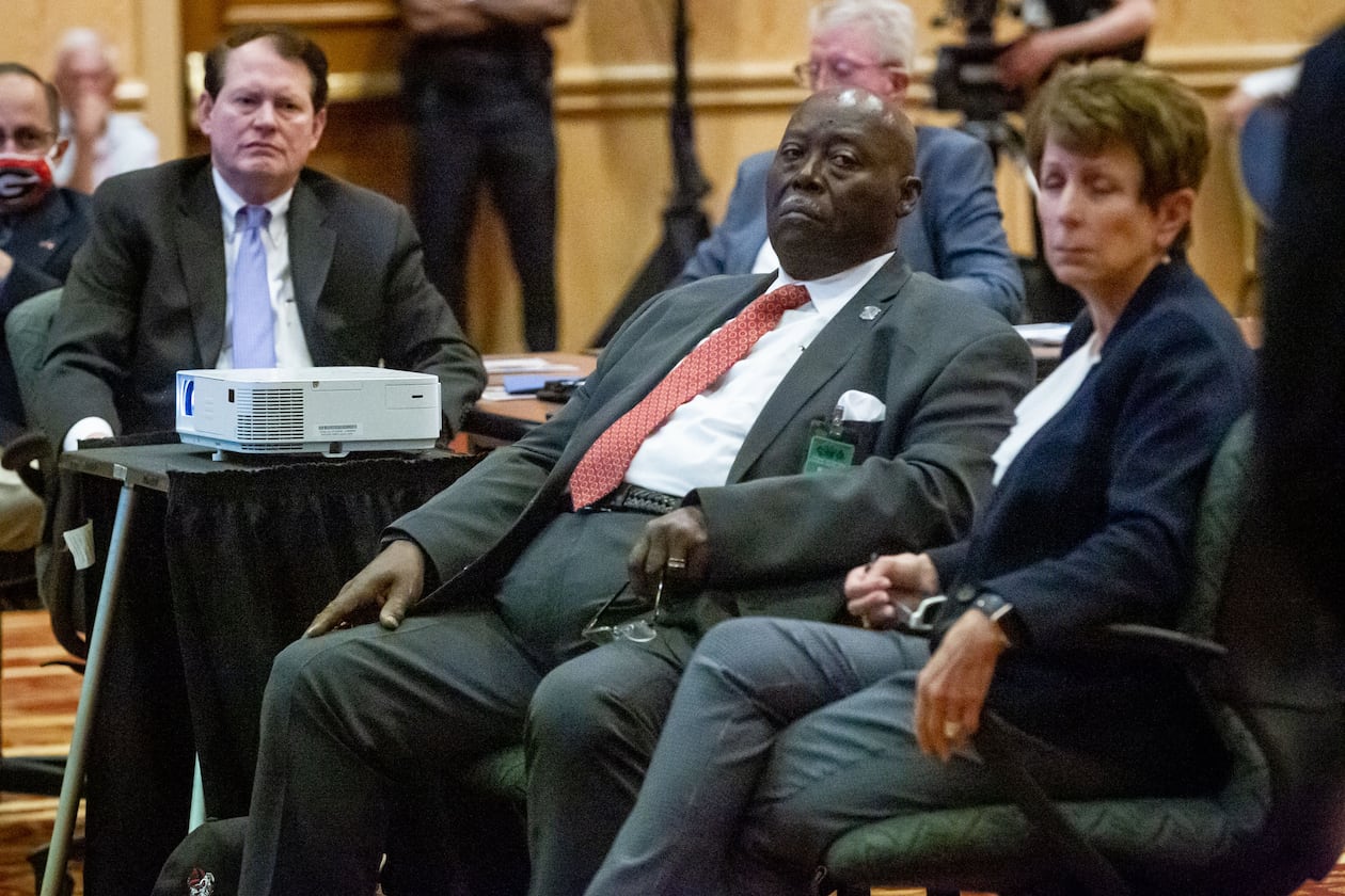 The Reverend Abraham Mosley (center) listens to Bill Stephens give a presentation during a Stone Mountain Memorial Association meeting Monday at the Evergreen Conference Center at Stone Mountain Park. STEVE SCHAEFER FOR THE ATLANTA JOURNAL-CONSTITUTION